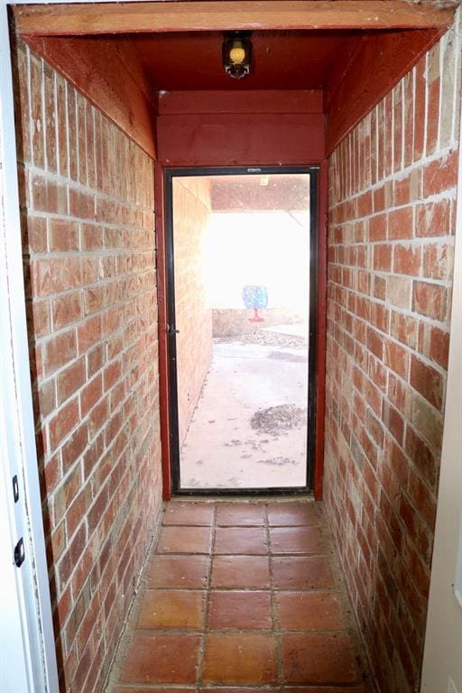 doorway with brick wall