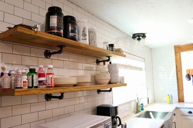 bar with backsplash and a sink