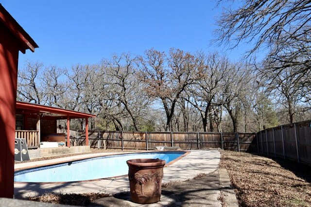 view of pool featuring a patio area, a fenced in pool, and a fenced backyard