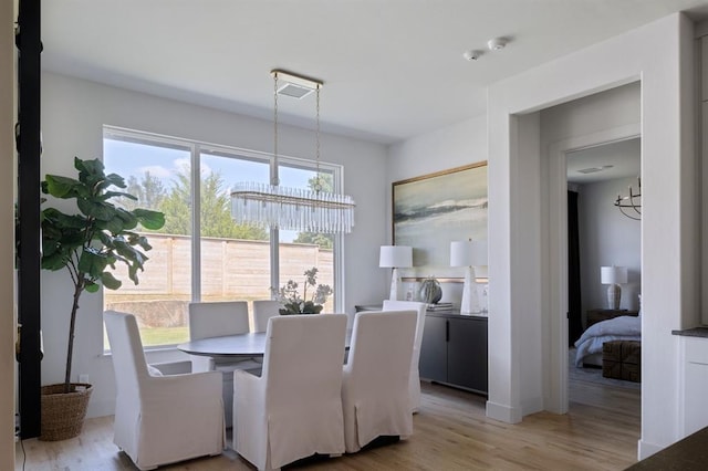 dining area with light wood-style flooring