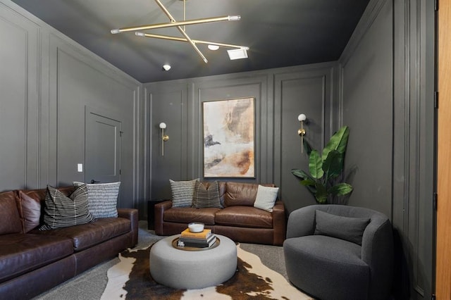 living area with carpet floors and a decorative wall