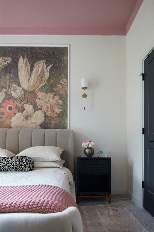 bedroom with carpet and baseboards