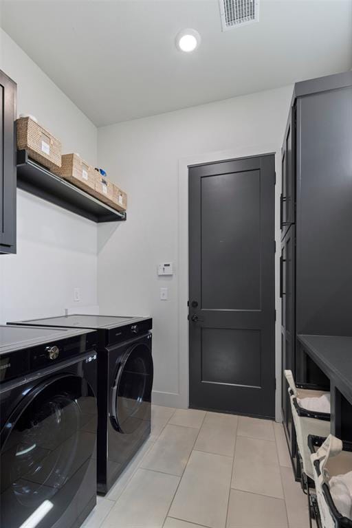 laundry room with light tile patterned floors, recessed lighting, visible vents, cabinet space, and washing machine and dryer