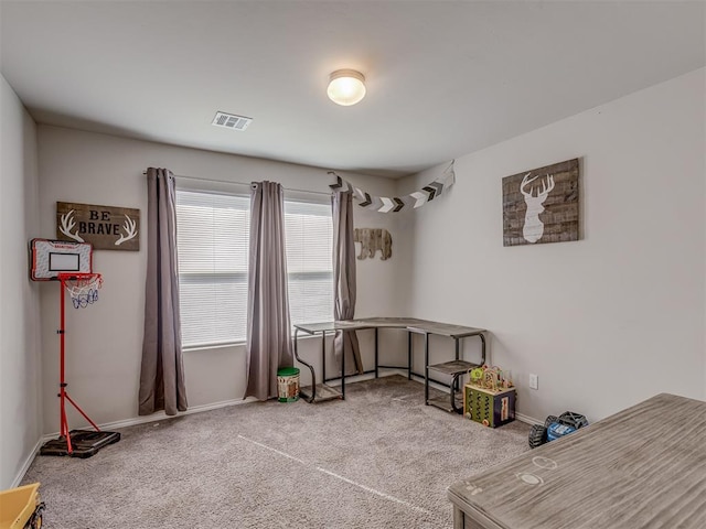 rec room featuring carpet floors, baseboards, and visible vents