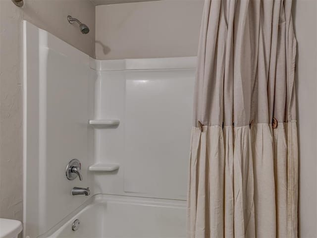 full bath featuring shower / tub combo with curtain