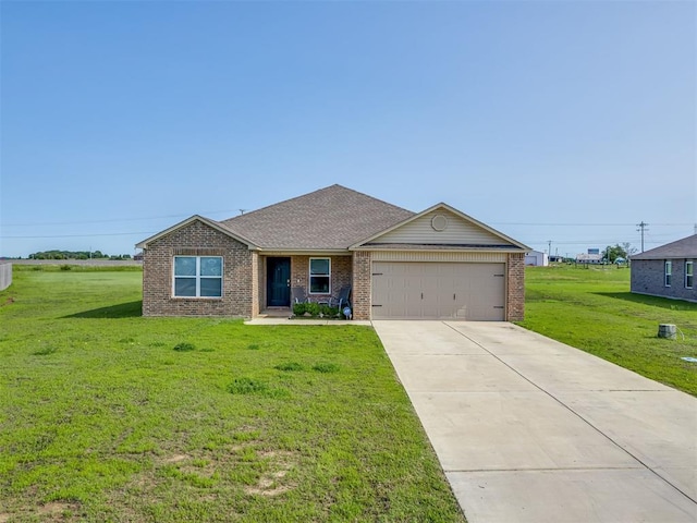 42056 Cadens Trl, Shawnee, OK 74804 - single story home featuring an attached garage, brick siding, a front lawn, concrete driveway, and a shingled roof