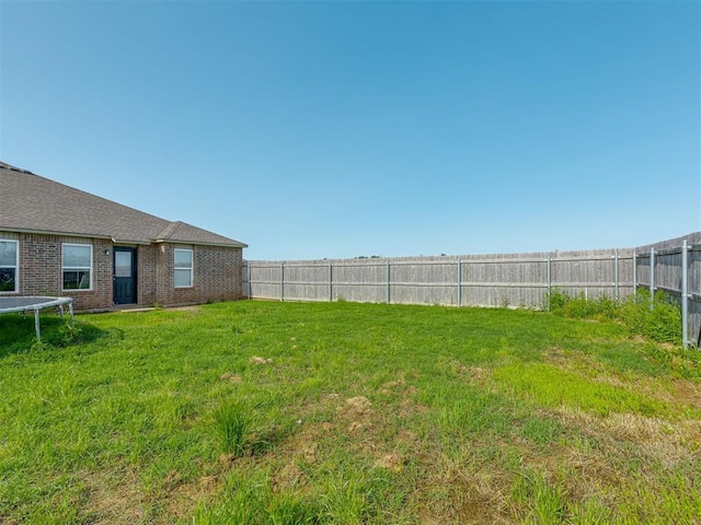 42056 Cadens Trl, Shawnee, OK 74804 - fenced backyard featuring a trampoline