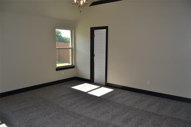 1525 NW 17th Pl, Newcastle, OK 73065 - unfurnished room with dark colored carpet, a ceiling fan, baseboards, and vaulted ceiling
