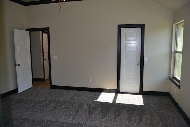 1525 NW 17th Pl, Newcastle, OK 73065 - empty room with carpet flooring, baseboards, and lofted ceiling