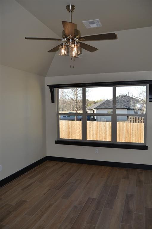 1525 NW 17th Pl, Newcastle, OK 73065 - empty room featuring a ceiling fan, visible vents, wood finished floors, baseboards, and high vaulted ceiling