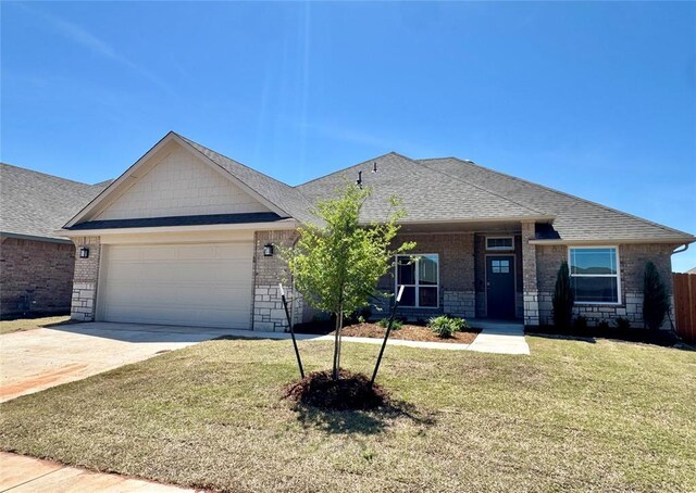 ranch-style house with brick siding, a front lawn, driveway, and a garage