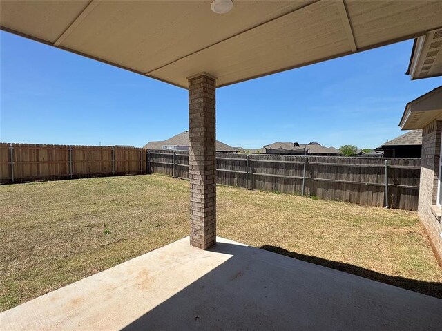 view of yard with a fenced backyard and a patio area