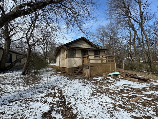 view of front of property with stairs and a deck