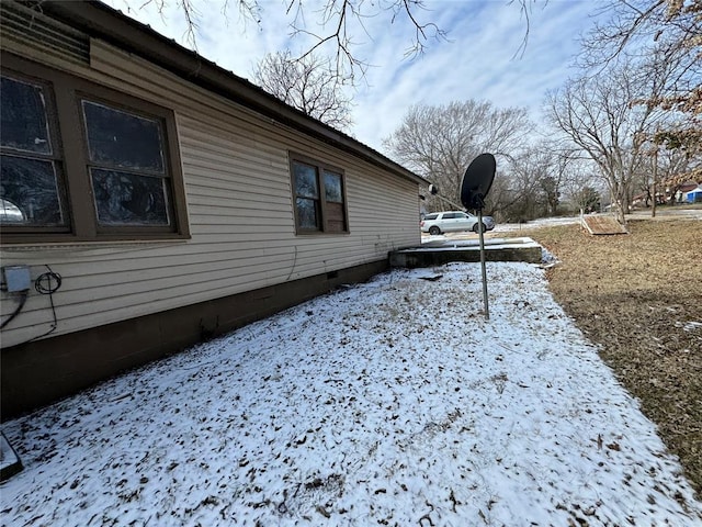view of side of property with crawl space