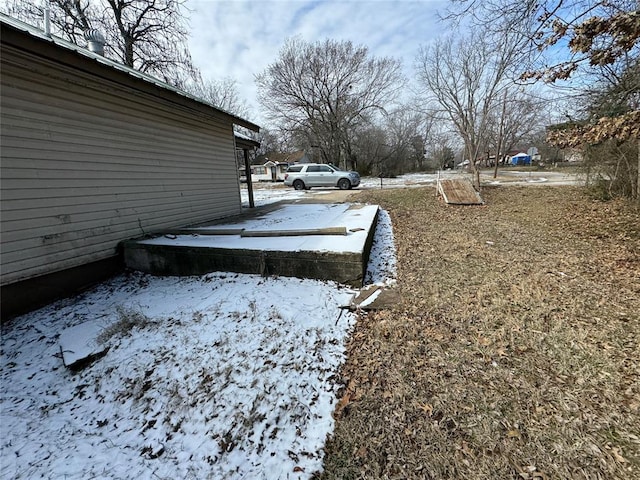 view of yard layered in snow