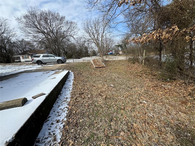 view of yard layered in snow