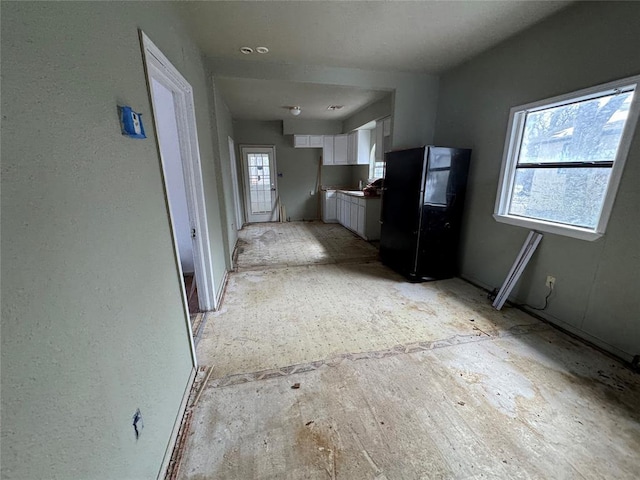 corridor featuring plenty of natural light