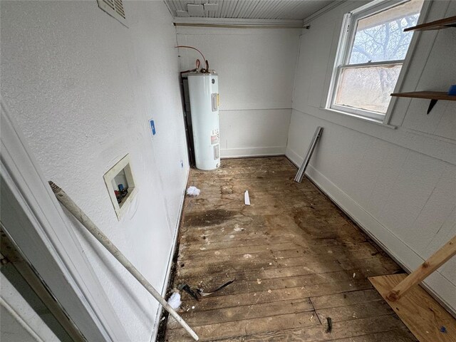 washroom featuring electric water heater, laundry area, washer hookup, ornamental molding, and hardwood / wood-style floors
