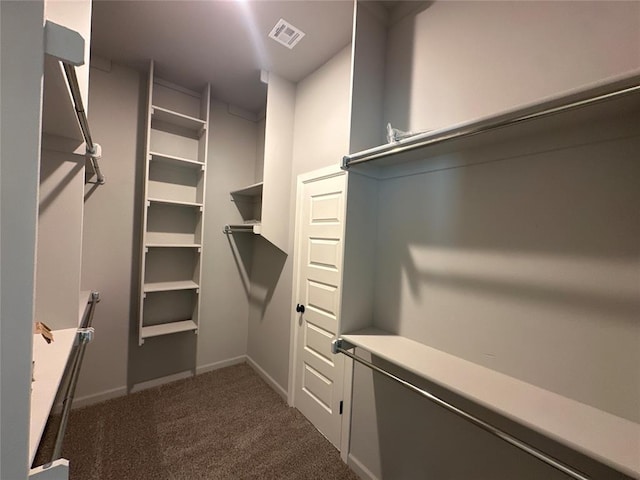 walk in closet with carpet flooring and visible vents