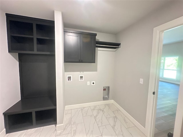 laundry area with marble finish floor, cabinet space, baseboards, hookup for an electric dryer, and hookup for a washing machine