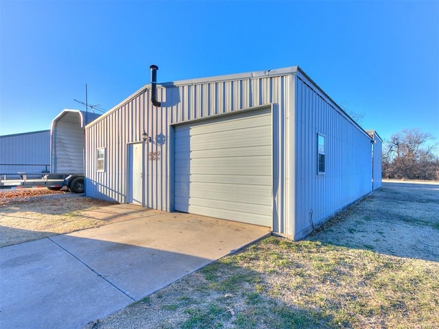 detached garage featuring driveway