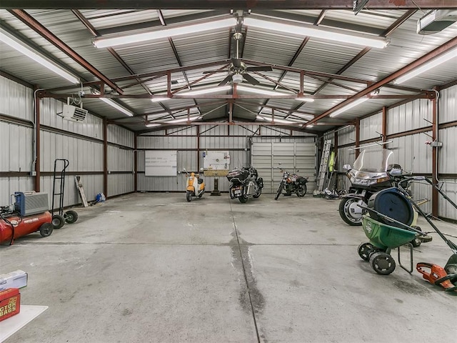 garage featuring a garage door opener and metal wall