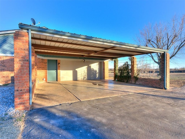 view of car parking featuring a detached garage