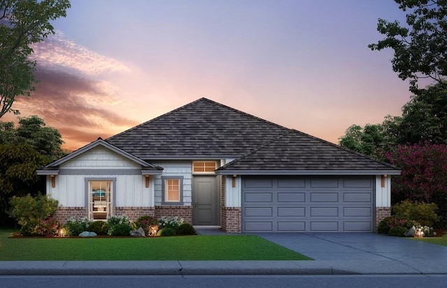 view of front of property with driveway, an attached garage, board and batten siding, and brick siding