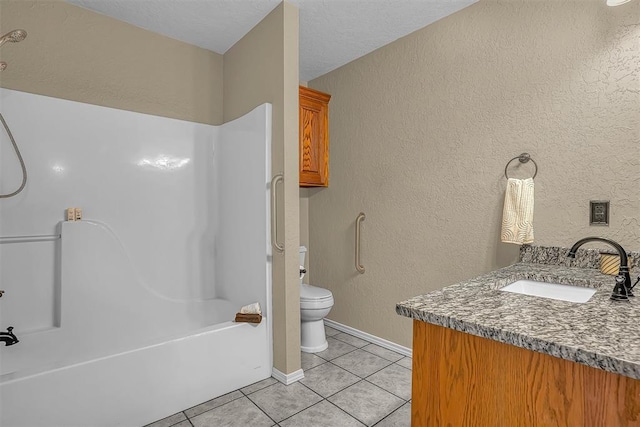 full bath with a textured wall, toilet, vanity, tub / shower combination, and tile patterned floors