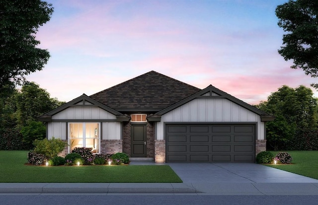 view of front of home featuring a garage, driveway, a front lawn, board and batten siding, and brick siding