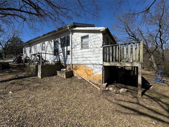 view of side of home featuring a deck