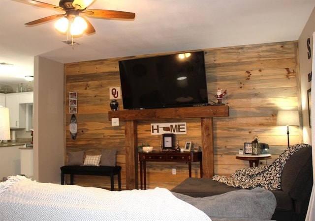 bedroom featuring wood walls