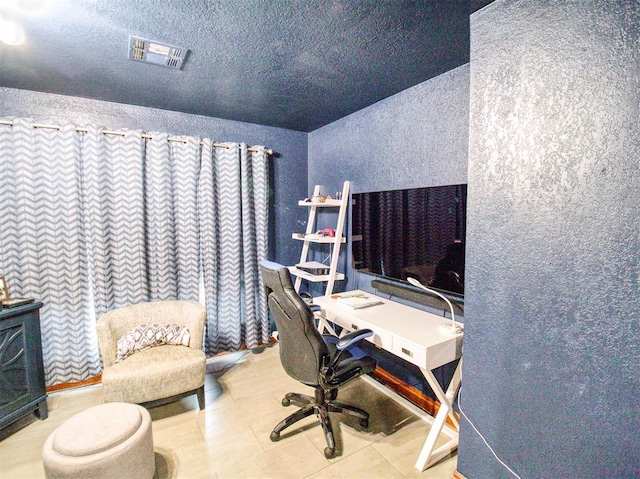 office featuring a textured ceiling and visible vents