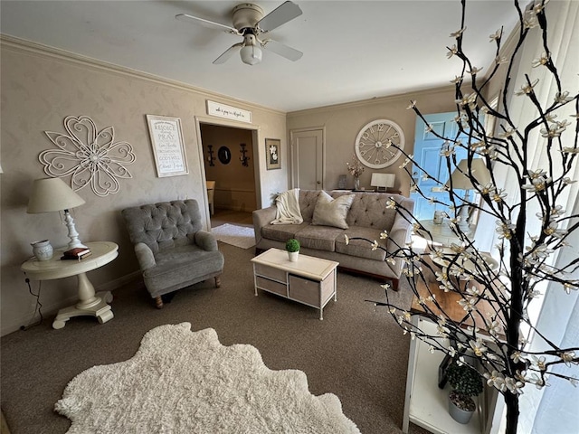 living room featuring ceiling fan, ornamental molding, and carpet flooring