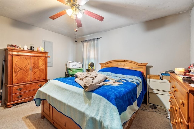 bedroom featuring light colored carpet and ceiling fan