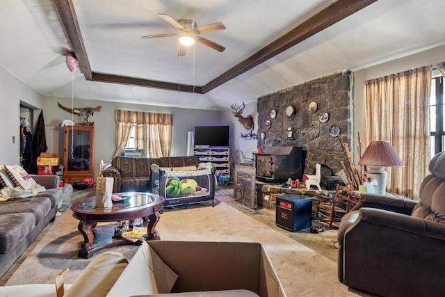 living room with a ceiling fan, a tray ceiling, beam ceiling, and light carpet