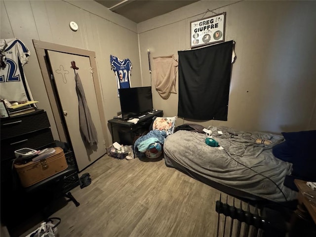 bedroom featuring wood finished floors