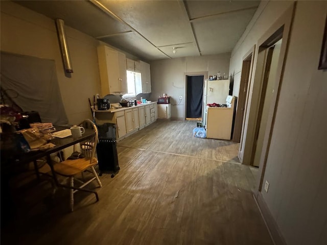 kitchen featuring light wood-style flooring and light countertops