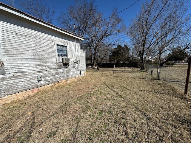 view of yard featuring fence and cooling unit