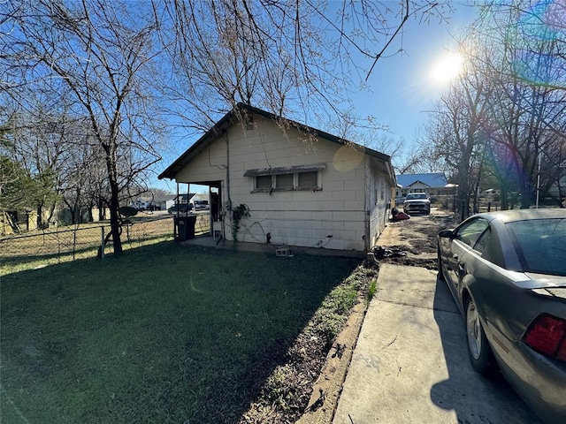 1416 Foster Ave, Seminole, OK 74868 - view of property exterior featuring fence and a lawn