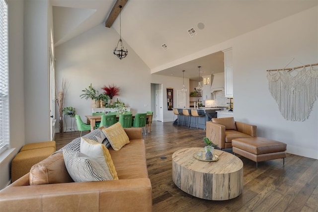 living room with beam ceiling, dark wood-type flooring, and high vaulted ceiling