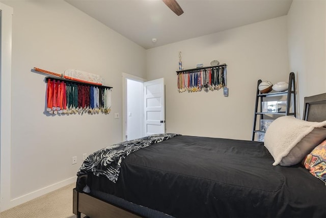 carpeted bedroom featuring baseboards and ceiling fan