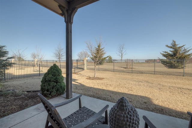 view of yard featuring a rural view and fence