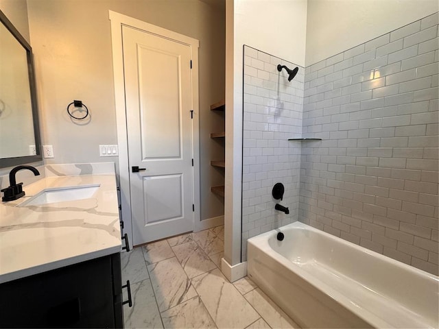 full bathroom with marble finish floor, shower / bathing tub combination, vanity, and baseboards