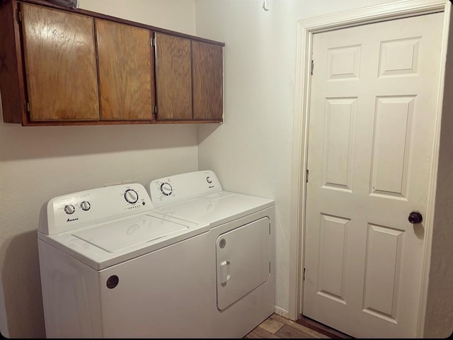 laundry area with cabinet space and washer and dryer