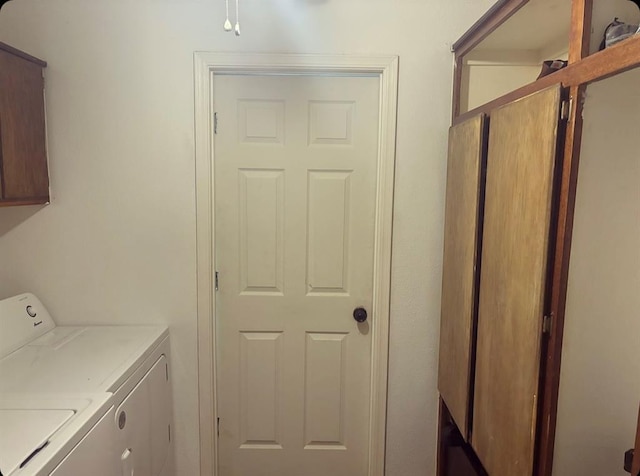 laundry room with cabinet space and independent washer and dryer