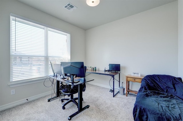 office with light colored carpet, visible vents, and baseboards