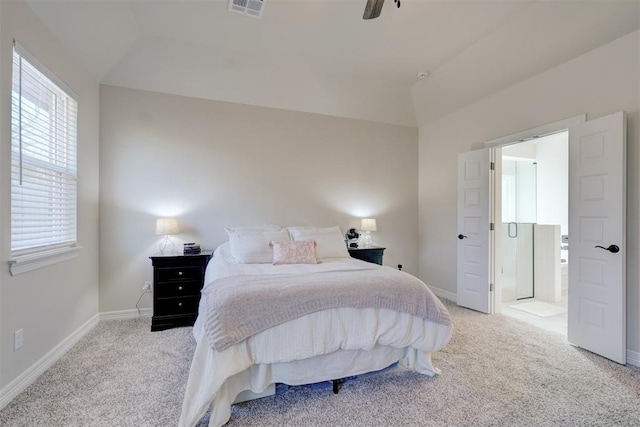 bedroom with light carpet, vaulted ceiling, visible vents, and baseboards