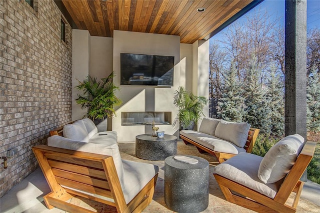 1212 W Wilshire Blvd, Nichols Hills, OK 73116 - view of patio featuring an outdoor living space with a fireplace
