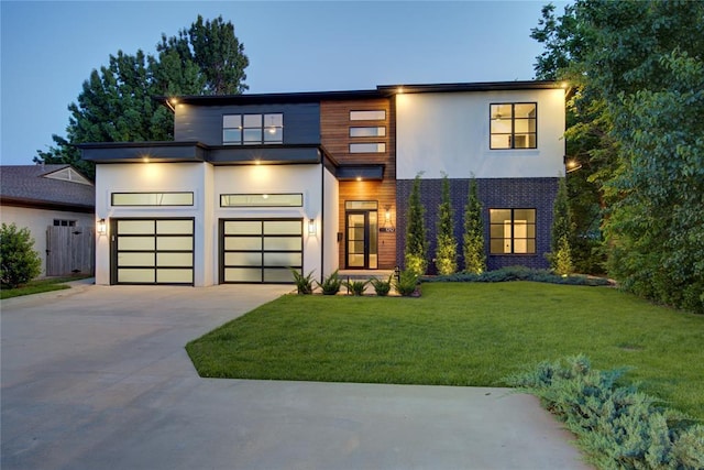 1212 W Wilshire Blvd, Nichols Hills, OK 73116 - contemporary house with driveway, stucco siding, and a front yard